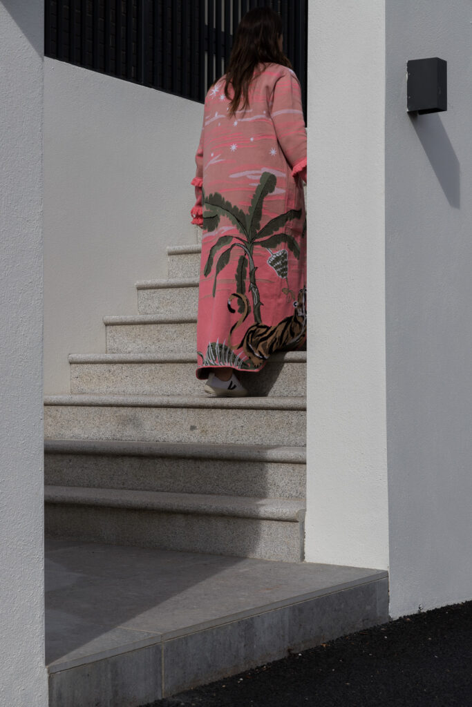 lady-wearing-kimono-dressing-gown-walking-up-stone-steps