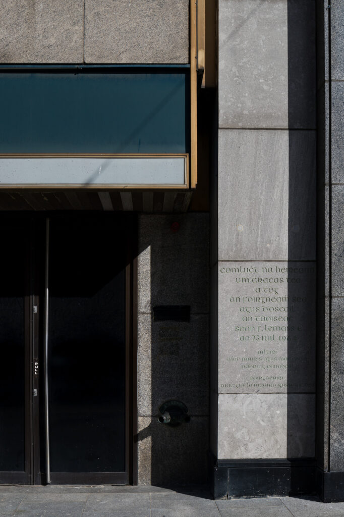 entrance-to-new-ireland-assurance-building-with-limestone-panels-and-engraved-writing