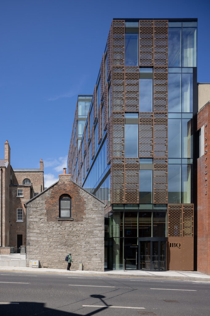 elevation-of-1BQ-building-on-henry-street-with-child-in-green-jacket-walking-by