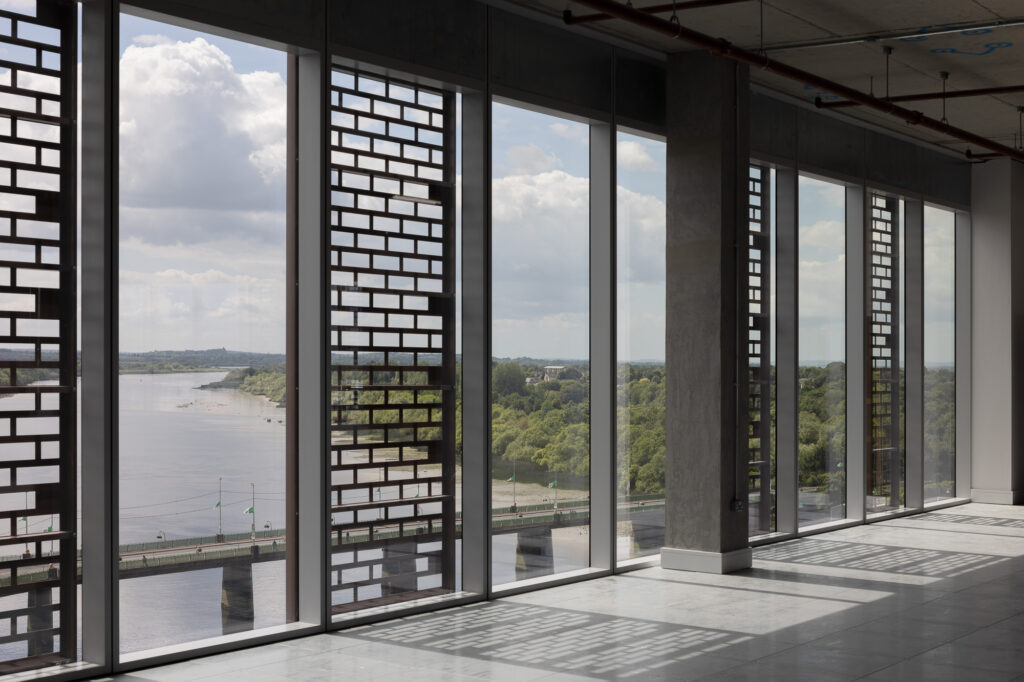 view-towards-the-shannon-river-in-limerick-through-windows-with-gridded-screen-panels