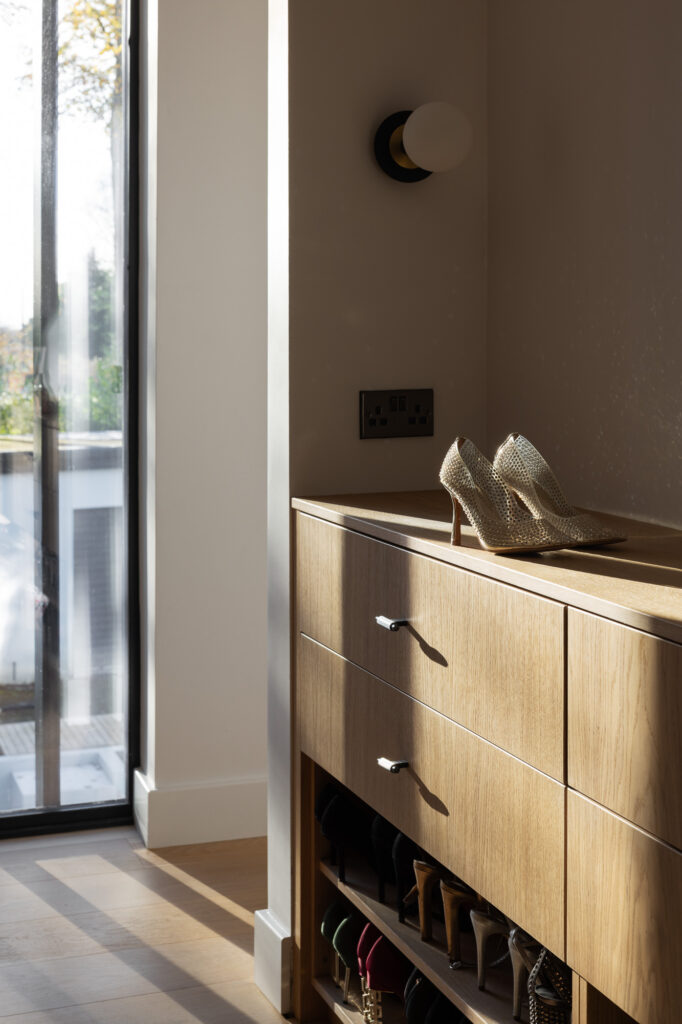 light-catching-golden-high-heeled-shoes-on-wooden-cabinetry