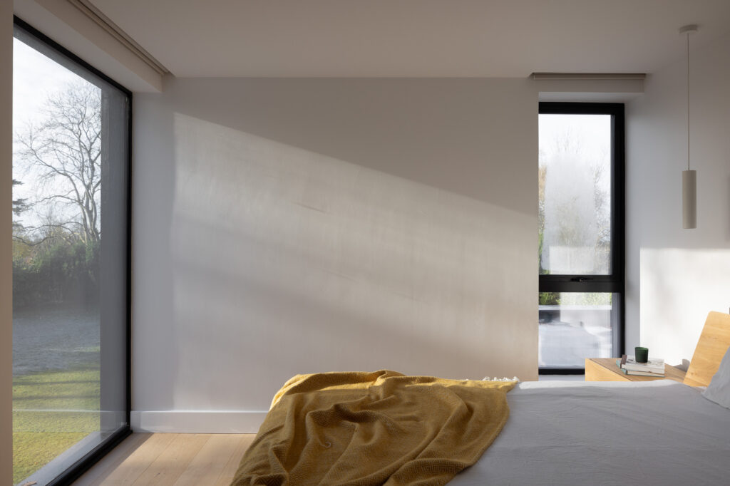 light-streaming-in-window-to-bed-with-yellow-blanket