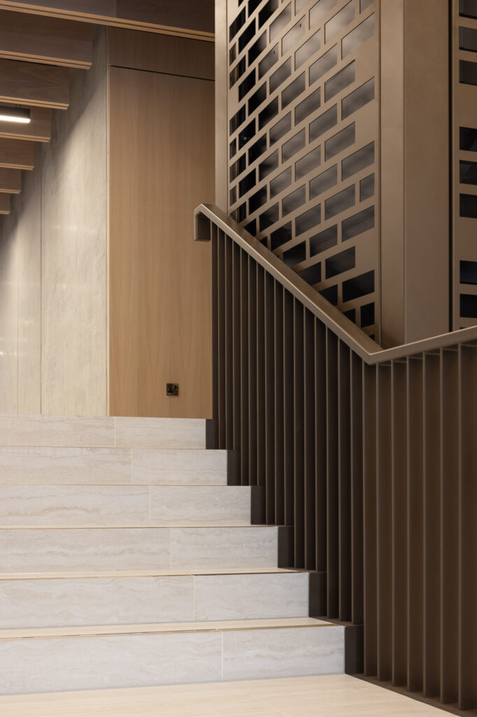 golden-brown-steel-stair-handrail-and-lift-with-marble-cut-steps