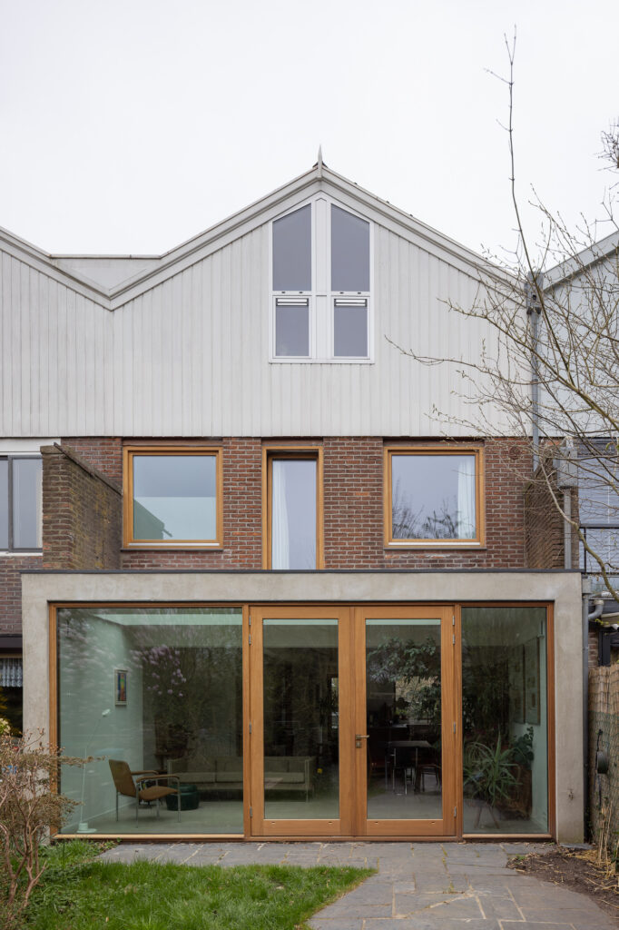 terraced-three-storey-home-with-concrete-extension-with-wooden-framed-windows