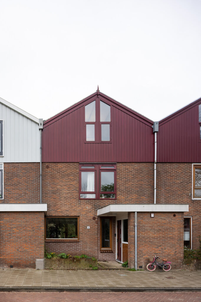 terraced-brick-homes-with-red-wooden-clad-upper-storeys