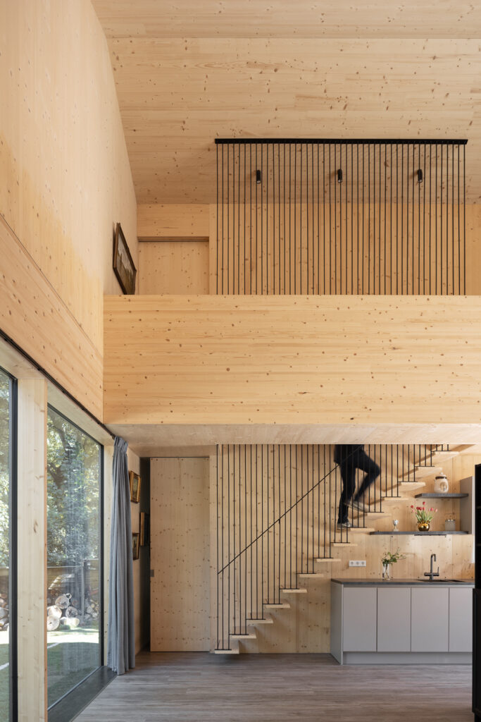 clt-barn-house-open-stair-hung-off-black-skinny-steel-balustrade-in-double-height-space
