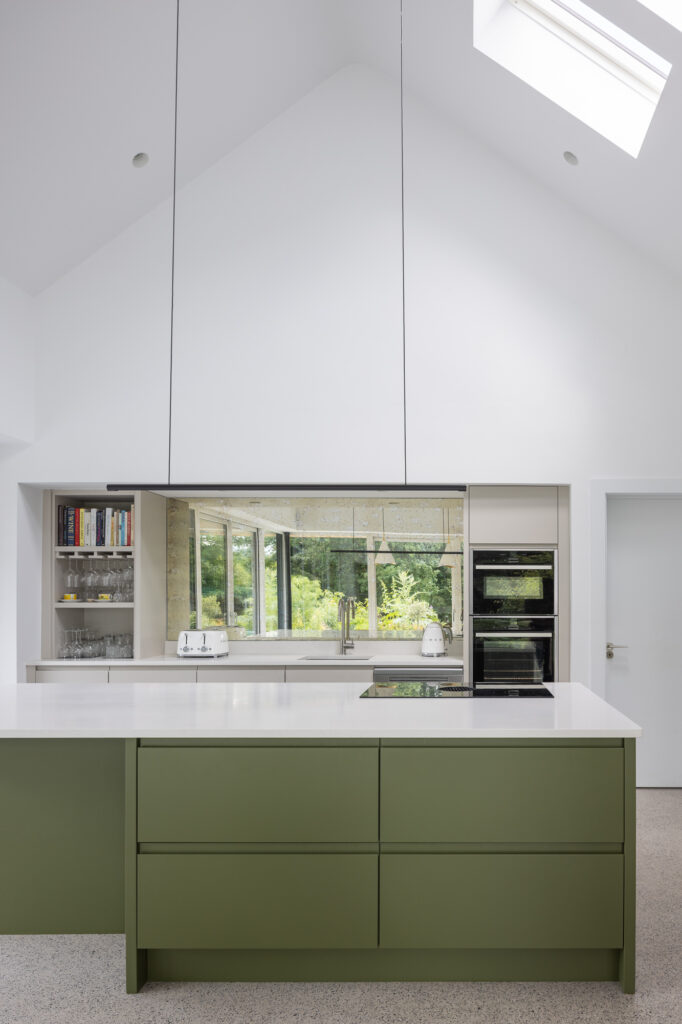 green-and-white-kitchen-with-high-pitched-ceiling