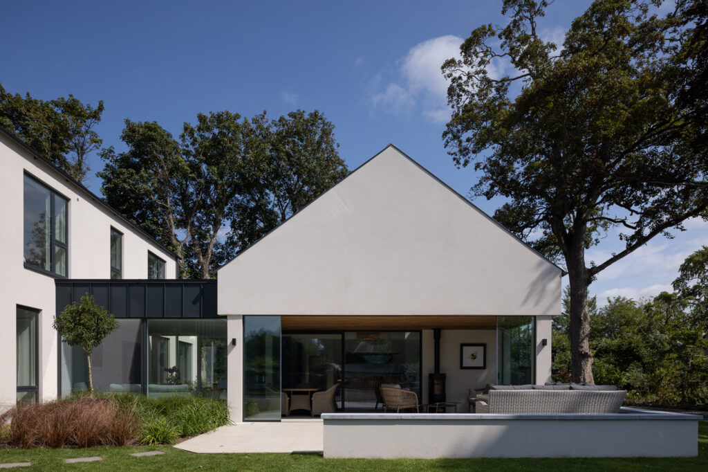 single-storey-extension-connected-to-two-storey-pitched-roof-via-zinc-clad-one-storey-connection