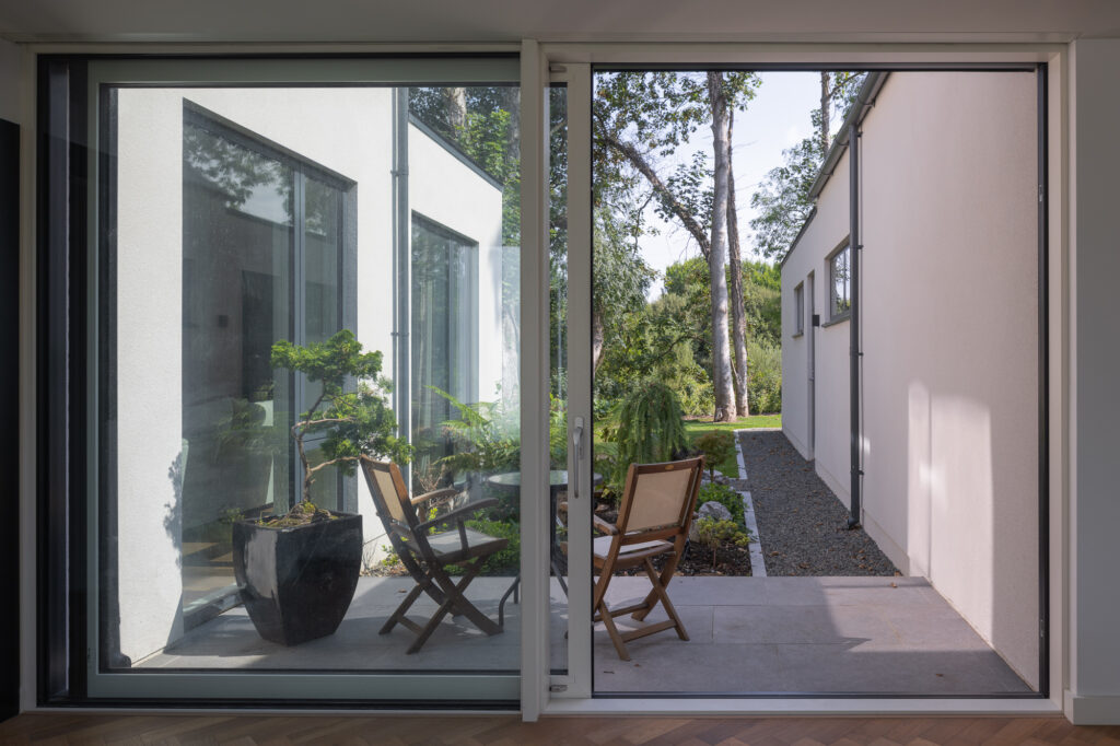 sliding-doors-to-patio-with-chairs-and-tables-and-view-to-garden